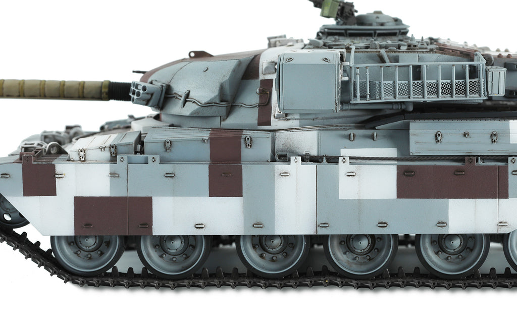A close-up side view of a military tank model or toy vehicle with a camouflage pattern in gray, white, and dark brown, shown against a plain white background.