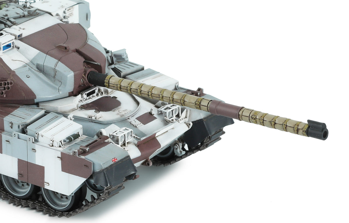 A close-up of a model tank destroyer, likely a T-80/85, featuring a desert camouflage pattern of brown, tan, and light gray, with a detailed long barrel and black tracks, shown against a plain white background.